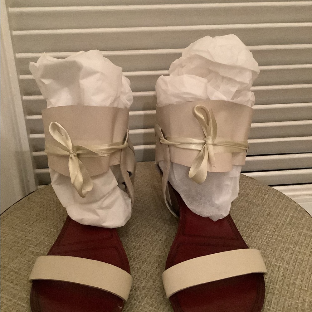 Tan half booth sandal with ribbon tie.